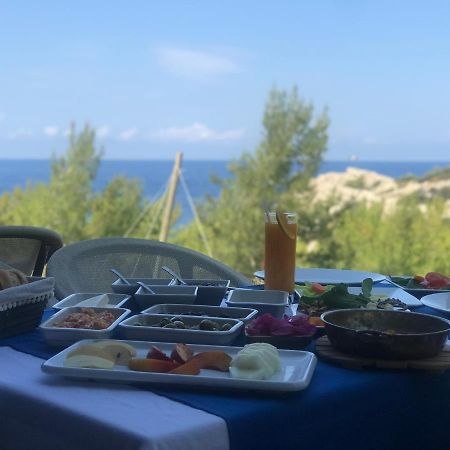 Rocas Roja Beach Hotel Faralya Bagian luar foto