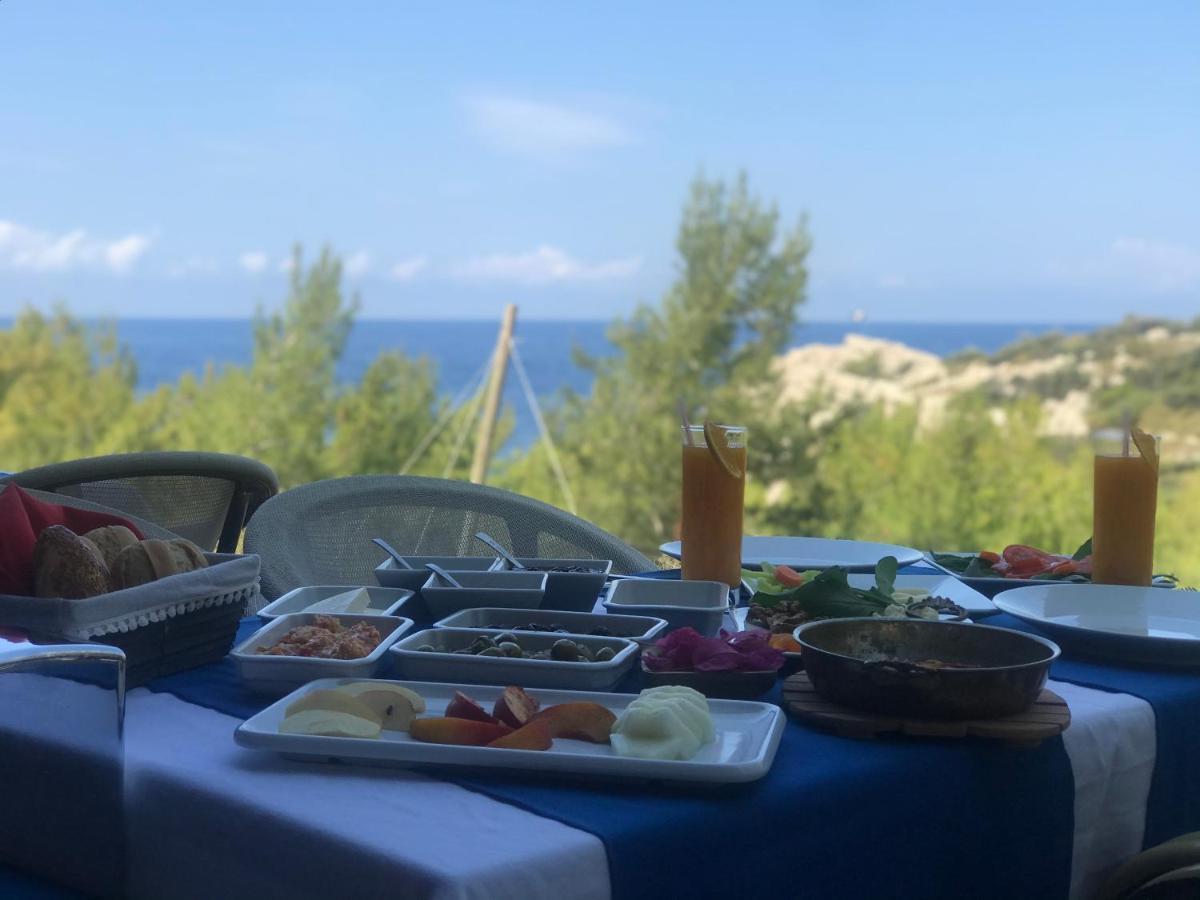 Rocas Roja Beach Hotel Faralya Bagian luar foto